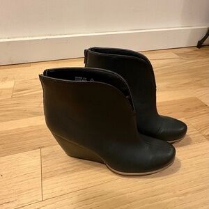 Stylish black wedge booties